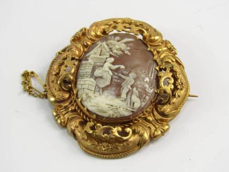 A cameo brooch of a pastoral scene, 19thC, in a foiled yellow metal mount embossed with flowers and foliate scrols, safety chain as fitted, 16.0g.