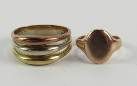 Two dress rings, a tricolour band and an unmonogrammed signet ring, yellow metal marked 9ct, 7.6g.