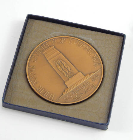 A bronze Armistice Day tenth anniversary medal, designed by Charles Leighfield, Doman 1928, the obverse showing Britannia supporting a young warrior, reverse the Cenotaph, Their Name Liveth for Evermore, November 11th MCMXVIII, boxed.