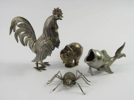 A group of white metal figures, comprising a cockerel, open mouthed fish, spider brooch and an elephant salt, (4).