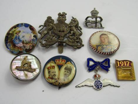 An RAF silver and enamal RAF wings badge, with a bow suspension, Warwickshire Regiment badge, 1917 Dreadnought badge, cap badge, three Royal commemorative badges and an enamel button, converted to a brooch, (8).