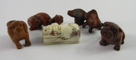 Javanese carved wooden netsuke, comprising a goldfish, rat and cat, Pekingese and a bull dog, and a faux ivory netsuke of a child in a papoose, (a quantity).