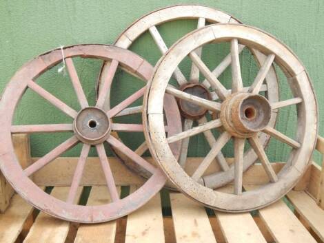 Three small cart wheels.