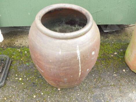 A large stoneware garden planter.