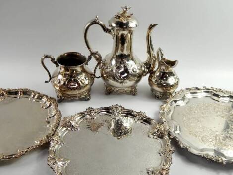 A Victorian plated three piece coffee set, embossed with flowers, and three plated salvers.