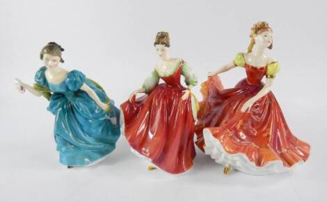 Three Royal Doulton figures, comprising Ninette HN3417, Rhapsody HN2267 and Fair Lady HN2832.