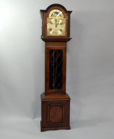 An oak longcase clock, with moon roller to arch, 193cm high