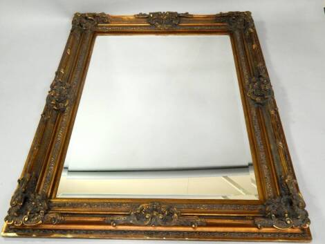 A deep gilt framed rectangular wall mirror, with bevel plate, 157cm x 126cm