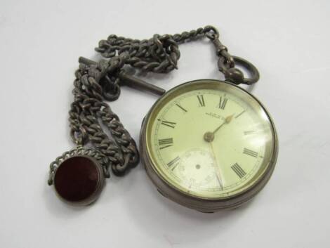 A Victorian gentleman's silver open faced keywind pocket watch, enamel dial bearing Roman numerals, subsidiary seconds dial, Waltham movement, on a silver Albert chain with T bar as fitted and swivel fob, Birmingham 1900.