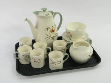 A Wedgwood pottery part coffee service, decorated in the Tiger Lily pattern, comprising coffee pot, cream jug, sugar bowl, six cans and saucers.