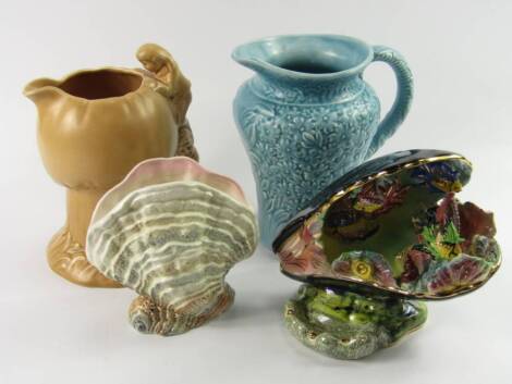 A Sylvac brown glazed mushroom jug, with double dwarf handle, No 1969, impressed marks, 21cm high, a shell vase, No 3523, a blue matt glazed floral jug, and a lustre shell dish moulded with fish and coral, (4).