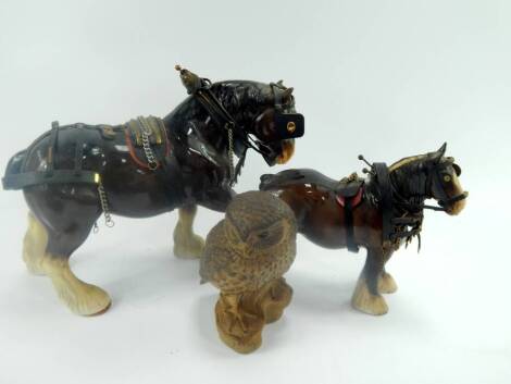 A Beswick pottery cart horse, 28cm high, a Sylvac pottery car horse, 25cm high, and a Poole Pottery owl modelled by B Lindley Adams, impressed and incised marks, 18cm high, (3).