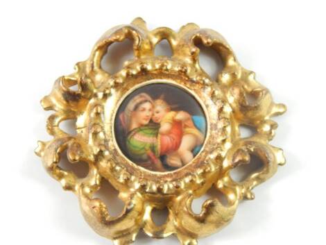 A miniature on porcelain of The Madonna and Child, after Raphael, in a giltwood scroll frame, 3.5cm diameter.