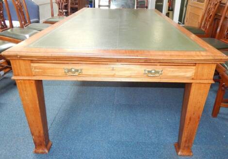 An Edwardian mahogany library table, with inset leather top, two frieze end drawers on square taper legs with swell feet, 120cm x 230cm