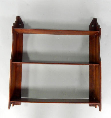 An Edwardian mahogany three shelf wall rack or bookstand, top shelf height 46cm