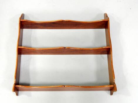 An Edwardian mahogany three shelf wall rack or bookstand, top shelf height 46cm