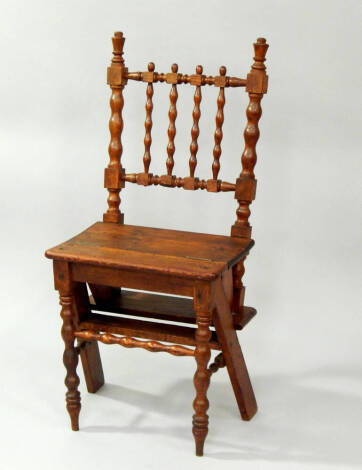 A Victorian pitch pine metamorphic library chair.