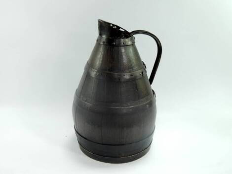 A coopered oak jug, with rustic iron work, 43cm high.