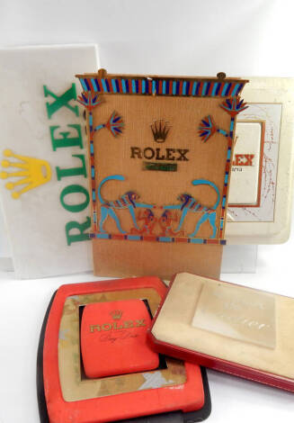 Four various Rolex advertising displays.