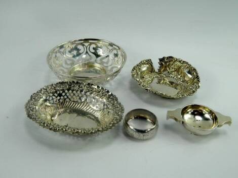 A George VI silver wine taster, of quaich form, Edinburgh 1935, silver sweetmeat dish of pierced foliate form, Sheffield 1913, two further Chester 1899 and Birmingham 1896 and a napkin ring, 7.07t oz.