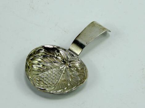 A George III silver caddy spoon, the bowl of artichoke chased form, Birmingham 1810, 0.265t oz.