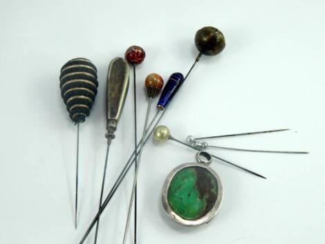 Victorian and later hat pins, including one set with an agate ball and two set with glass, together with a jade set white metal pendant, (10).