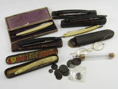 Victorian cut throat razors, cased, coins, a douche syringe and a pair of yellow metal rimmed spectacles, cased, (a quantity).