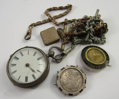 A Victorian lady's silver open faced key wind pocket watch, enamel dial bearing Roman numerals, movement by Davies & Co, Birmingham and London, No 31624, case with floral engraving, Chester 1888, on a plated Albert chain, further chains, a WWI memorial br