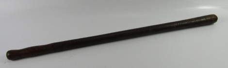 A tribal club, with carved ring and dog tooth decoration, 75cm long.