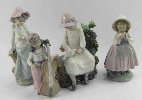 A group of Lladro Nao porcelain figures, comprising a seated girl with doves, further girl with a dove, girl with a double bass and a girl with a posy, (4).