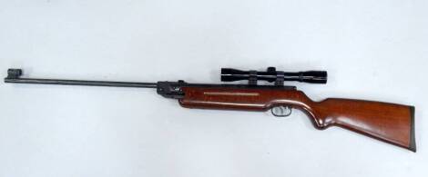 A Weihrauch air rifle, with an Apollo 4x32 gun sighting, cased.