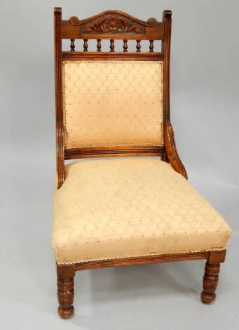 A late Victorian beech and walnut nursing chair