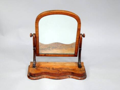 A Victorian mahogany dressing table mirror, with serpentine base, 56cm wide