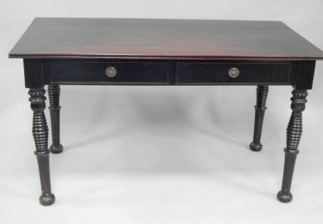 An ebonised rectangular table, with carved and turned legs, 75cm x 136cm