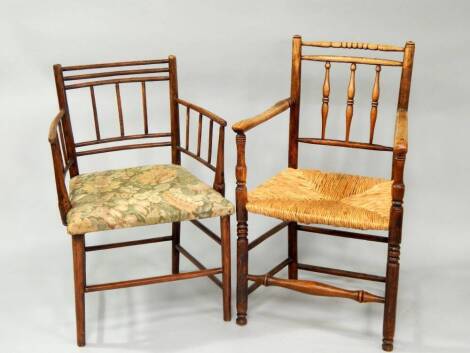 Two 19thC spindleback country chairs with arms.