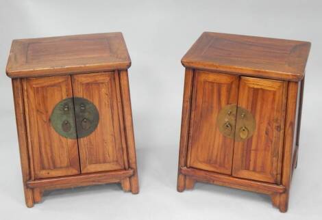 A pair of huali wood Chinese bedside cabinets, 63cm high