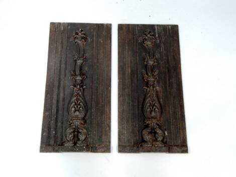 A pair of cast iron panels, 54cm x 26cm