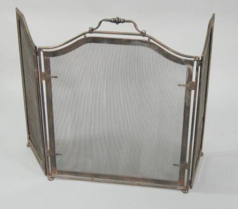 A modern wrought metal three section spark guard, 76cm high