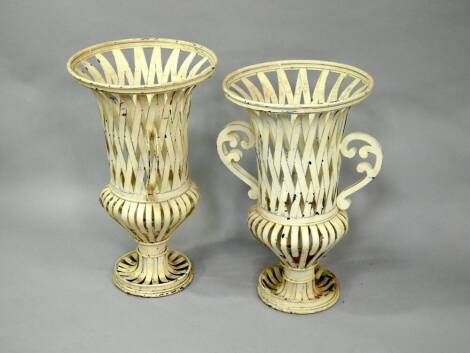 A pair of wrought iron campana style latticework urns, 72cm and 77cm high