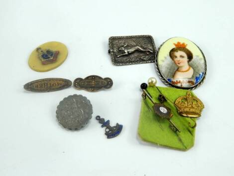 Jewellery, including a Royal Army Service Corps brooch, a Royal Navy charm and brooch plaque, white metal brooch embossed with a hare, and a porcelain pendant brooch decorated with the bust portrait of a lady, (a quantity).