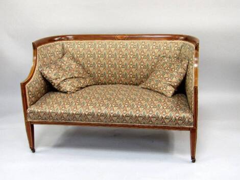 A late Victorian mahogany boudoir sofa, with string inlaid decoration and floral stylised upholstery, 125cm wide.