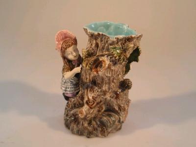 A late 19thC continental majolica vase in the form of an old tree stump