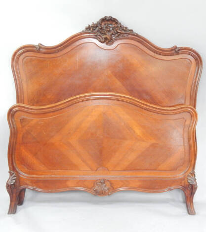 An early 20thC French walnut bedstead.