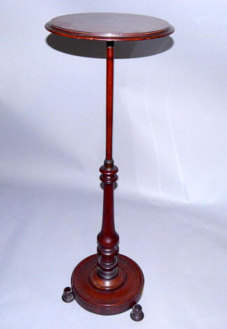 A Victorian mahogany jardiniere stand, made up, the circular top above a straight and turned column, circular base, raised on three turned feet, 106cm high.