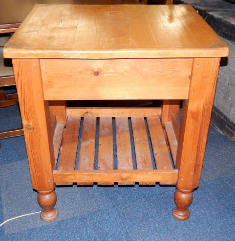 A pine butcher's block, with a slatted under tier, 74.5cm x 61cm x 83cm.