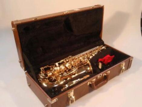 A brass saxophone, signed Blessing, Elk Heart Ind, in a fitted case