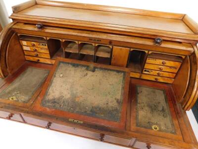 A Victorian mahogany roll top estate desk by T Willson, 68 Great Queen Street, London, the three sided pediment above a roll top, opening to reveal recesses, doors and drawers, above a central tooled leather writing slope, flanked by two recesses, one fit - 2