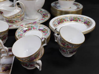 A Spode porcelain part tea dinner and coffee service decorated in the Provence pattern, comprising oval meat platter, a pair of oval dishes, pair of sauce boats on stands, ten dinner plates, dessert bowls, tea and coffee pots, milk and cream jugs, sugar b - 3