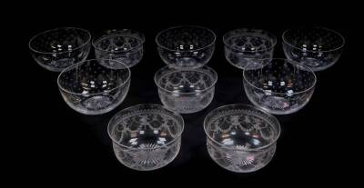 A set of five Victorian cut glass finger bowls, engraved with a repeating star pattern, 12.5cm diameter, together with five Edwardian cut glass finger bowls, engraved with floral swags, 11cm diameter. (10)