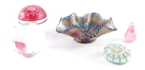 A Tiffany & Company glass paperweight modelled as an apple, (AF), Wedgwood glass paperweight modelled as a mushroom, a millefiori glass paperweight, iridescent glass paperweight modelled as a pear, and a sapphire blue carnival glass dish, 18cm wide. (5)